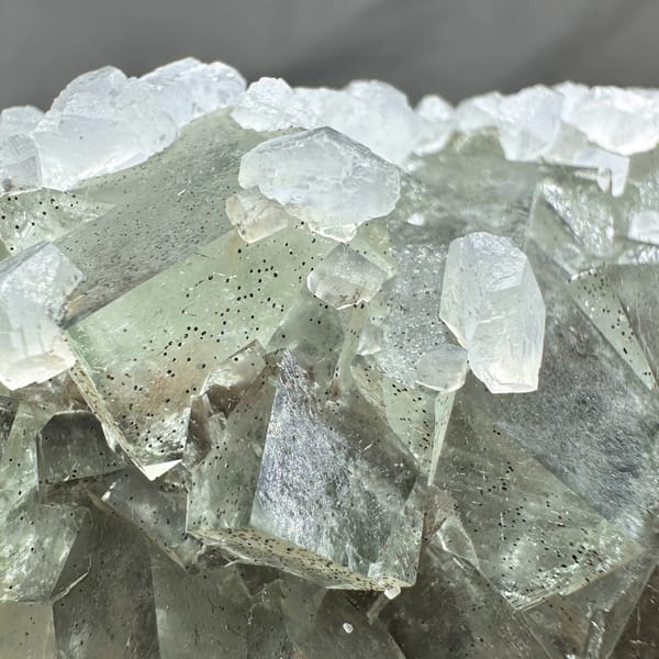 Pale grey-green fluorite cubes with white calcite on plate from Xianghualing, Hunan, China, second angle