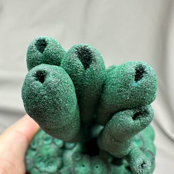 Dark green malachite stalactite pillars from DR Congo, top view