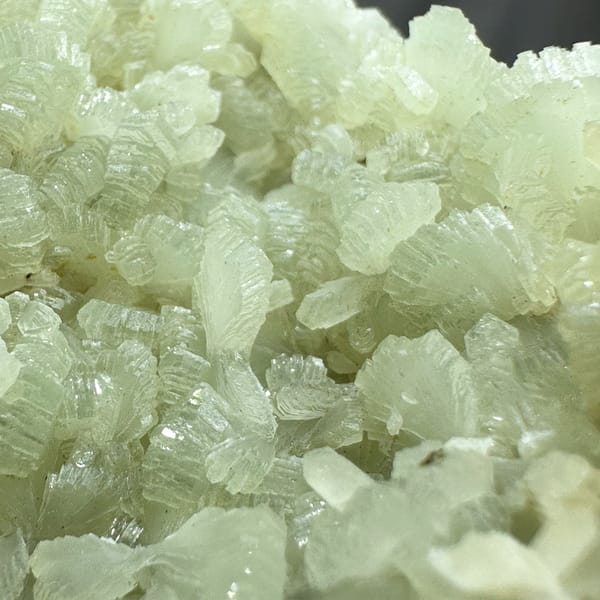 Pale green bow-tie prehnite plate with epidote from Morocco, reverse side