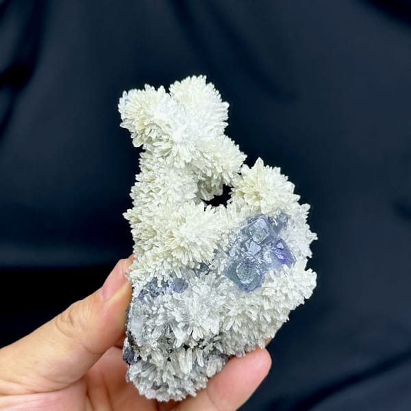 White quartz-needle flowers around blue-green fluorite from Fujian, China, close-up of the crystal faces