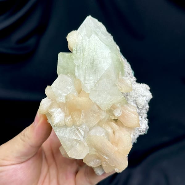 Large pale-green apophyllite crystal with peach stilbite from India, reverse side