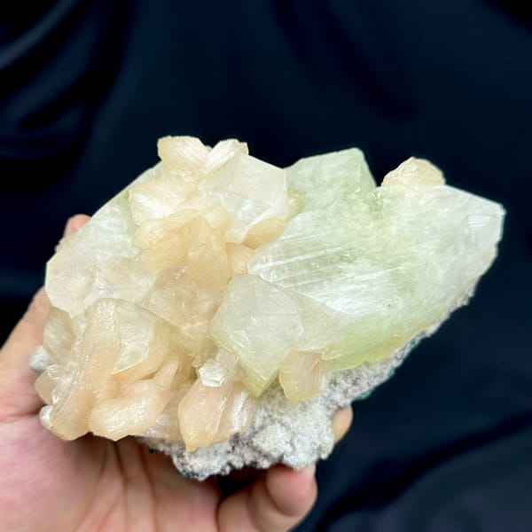 Large pale-green apophyllite crystal with peach stilbite from India, top view