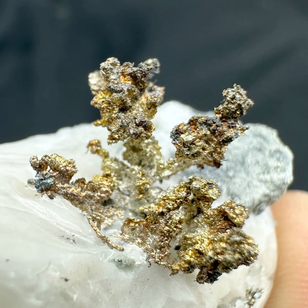 Iridescent dendritic native silver on white calcite from the USA, second angle