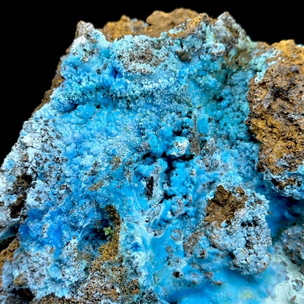 Electric-blue allophane crust in rusty rock pocket from Yunnan, China, second angle