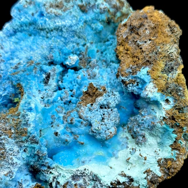 Electric-blue allophane crust in rusty rock pocket from Yunnan, China, reverse side