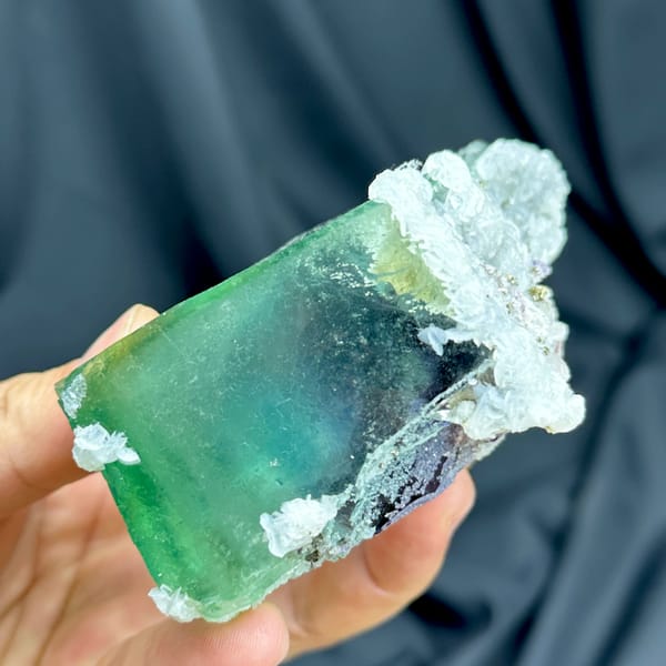 Large glassy phantom fluorite with red, green and blue layers from Inner Mongolia, China, close-up of the crystal faces