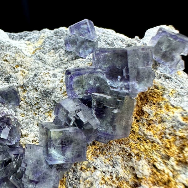 Blue-green phantom fluorite cubes on tan-stained plate from Fujian, China, top view