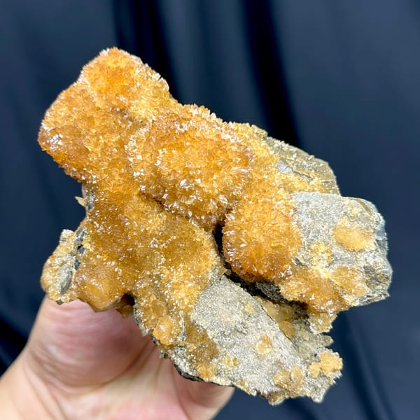 Golden-amber calcite with sparkling crystal skin from Inner Mongolia, China, top view