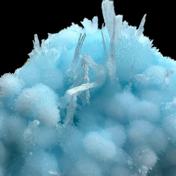 Dome of sky-blue acicular aragonite balls from Yunnan, China, close-up of the crystal faces