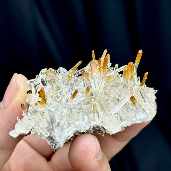 Clear quartz needles with mango-orange tips from Jinkouhe, Sichuan, China, second angle