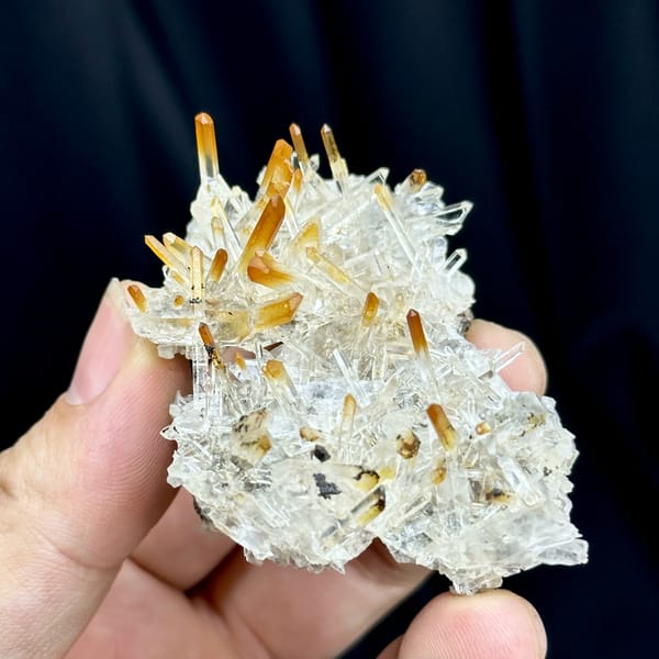 Clear quartz needles with mango-orange tips from Jinkouhe, Sichuan, China, reverse side