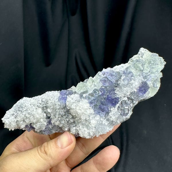Long bar of sparkling quartz with violet-blue fluorite from Fujian, China, top view