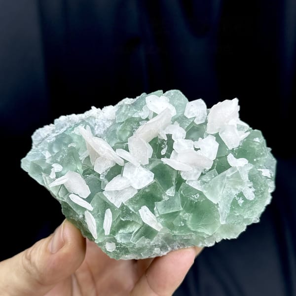 White calcite blades over mint-green fluorite from Fujian, China, detail of the matrix contact