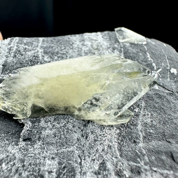 Large transparent double-terminated baryte blade on grey rock from Guangxi, China, top view