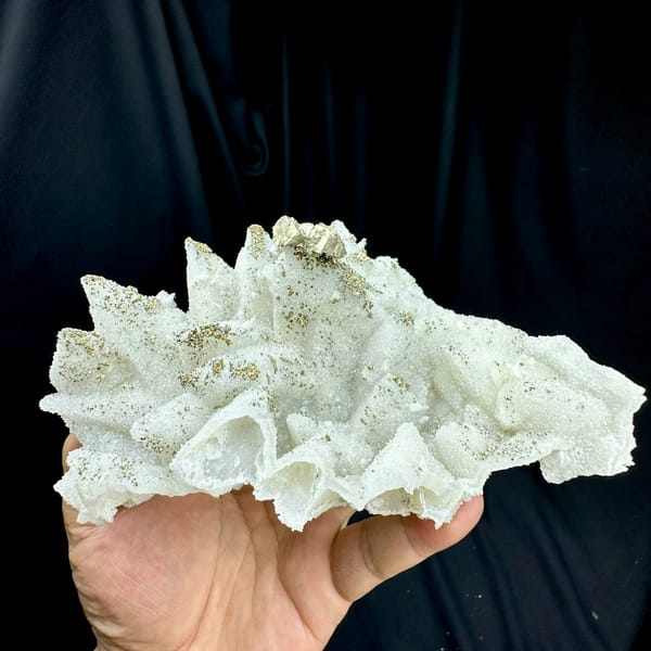 Pale quartz pseudomorphs after calcite with pyrite from Fujian, China, close-up of the crystal faces
