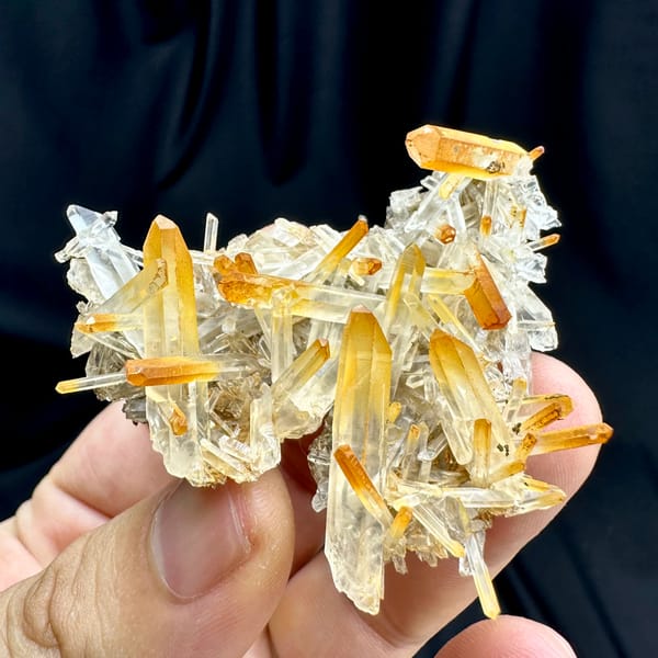 Clear quartz needles with mango-orange tips from Jinkouhe, Sichuan, China, second angle