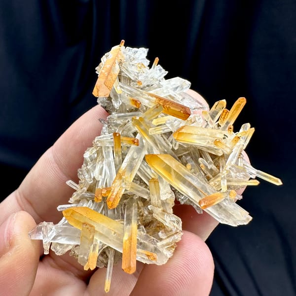 Clear quartz needles with mango-orange tips from Jinkouhe, Sichuan, China, reverse side