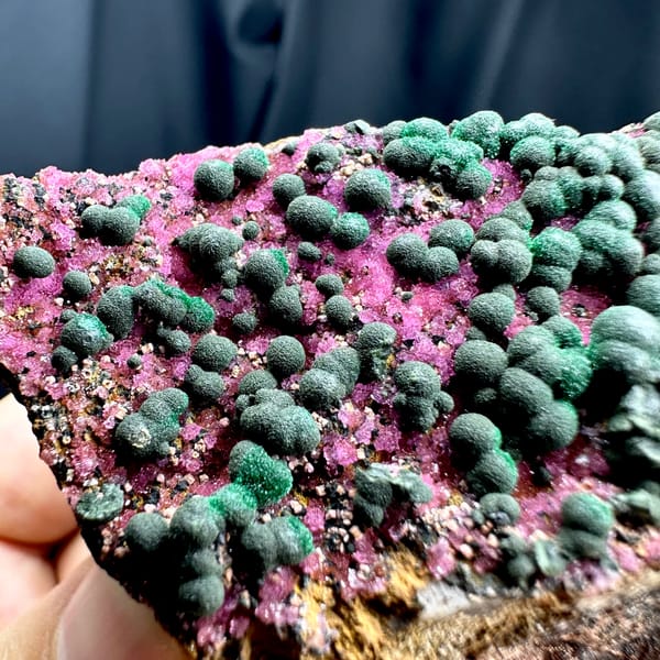 Green malachite balls over hot-pink cobaltoan calcite from DR Congo, second angle