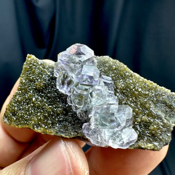 Glassy blue-green stepped fluorite cubes on olive quartz from Fujian, China, reverse side