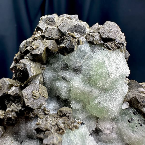 Frosted mint-green fluorite between chocolate-brown calcite from Fujian, China, second angle