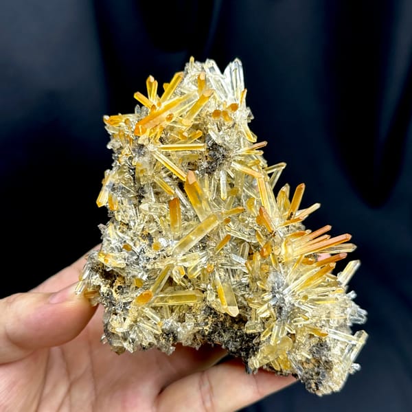 Cluster of clear quartz needles with mango-orange tips from Jinkouhe, Sichuan, China, reverse side
