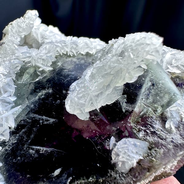 Dark phantom fluorite cube in white calcite with pyrrhotite from Inner Mongolia, China, top view