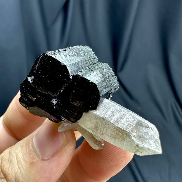 Clear smoky quartz point on black tourmaline base from Namibia, second angle