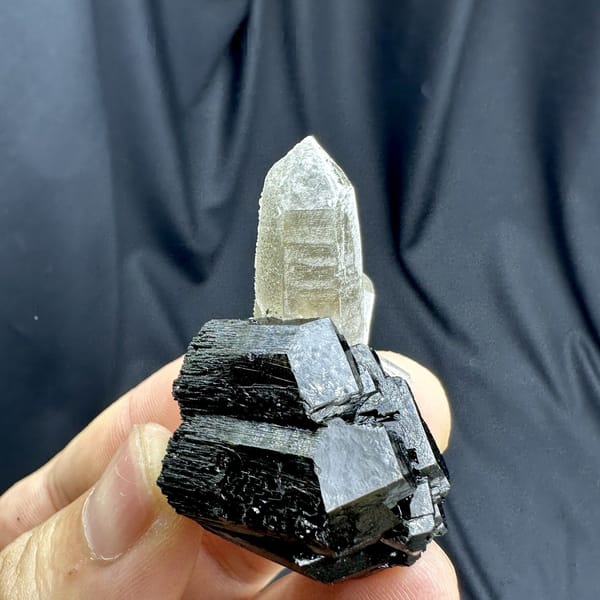 Clear smoky quartz point on black tourmaline base from Namibia, detail of the matrix contact
