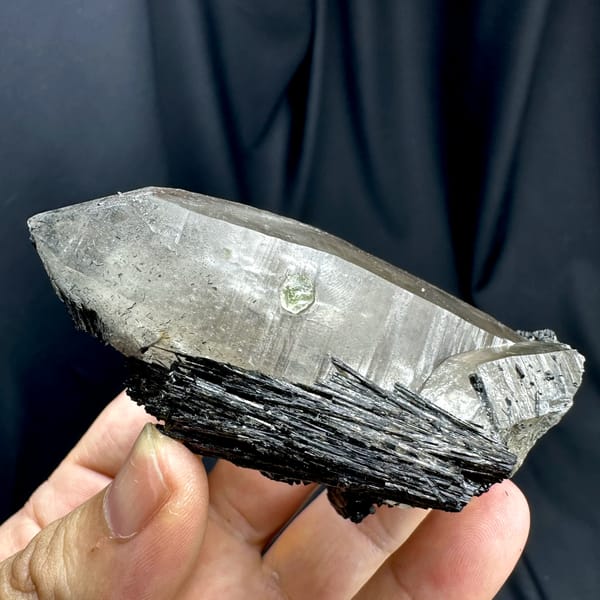 Large smoky quartz crystal with black tourmaline base from Namibia, reverse side