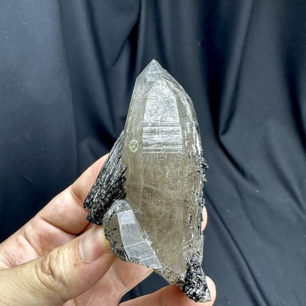 Large smoky quartz crystal with black tourmaline base from Namibia, detail of the matrix contact