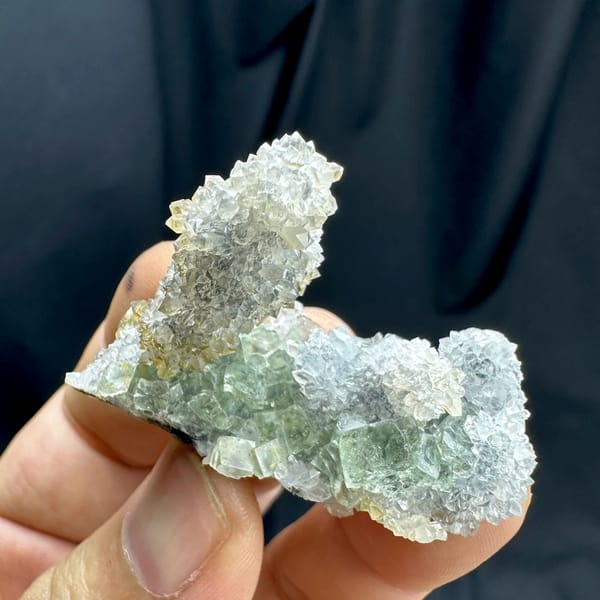 Pale green fluorite plate with quartz-druse stalk from Fujian, China, top view
