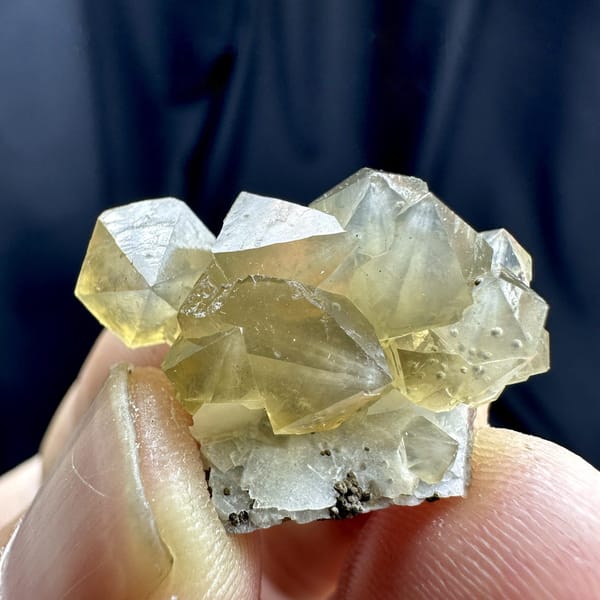 Yellow diamond-shaped quartz crystals with goethite from Inner Mongolia, China, detail of the matrix contact
