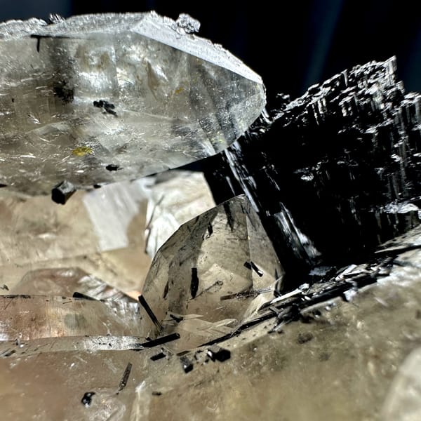 Clear smoky quartz prisms with black tourmaline cluster from Namibia, top view