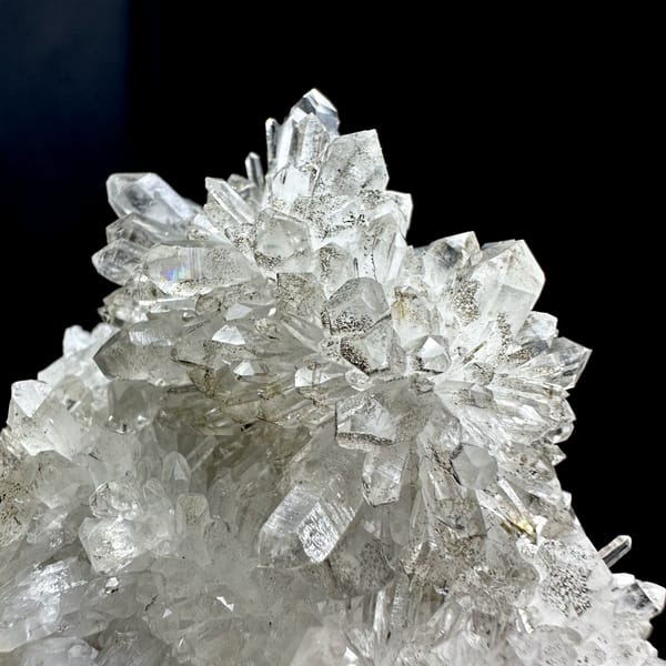 Chrysanthemum-quartz cluster of radiating clear needles from Fujian, China, reverse side