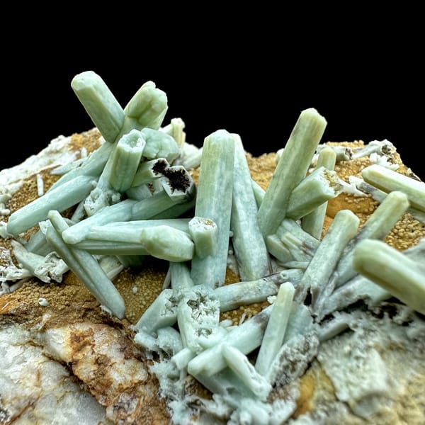 Pale green plumbogummite prisms on ochre matrix from Guangxi, China, reverse side