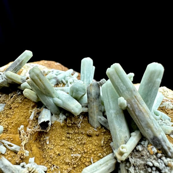 Pale green plumbogummite prisms on ochre matrix from Guangxi, China, top view