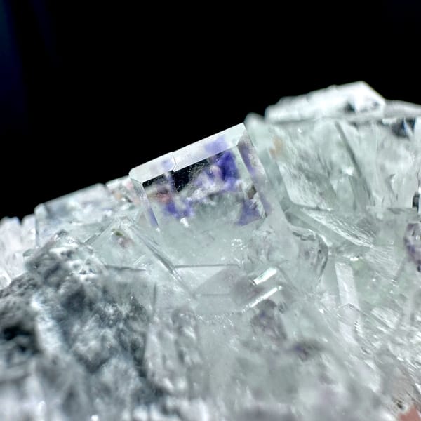 Glass-clear fluorite cubes with faint blue tint on quartz from Zhejiang, China, second angle