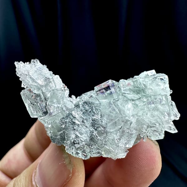 Glass-clear fluorite cubes with faint blue tint on quartz from Zhejiang, China, top view