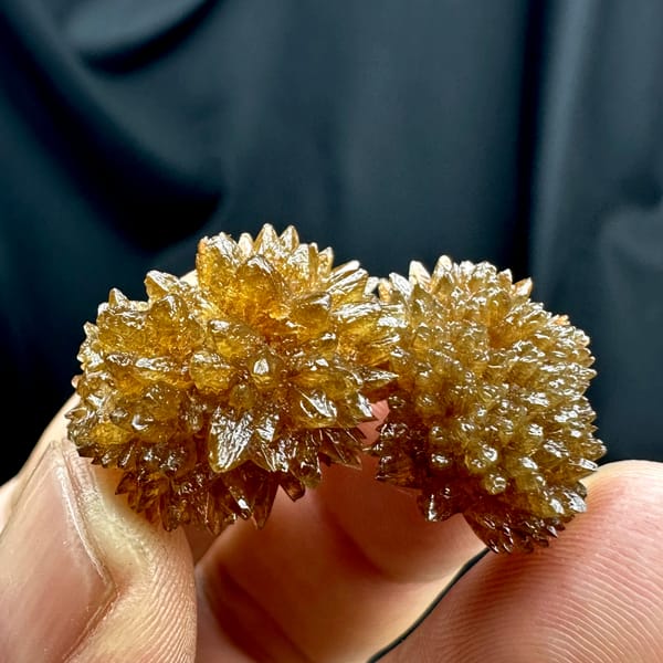 Amber calcite balls of radiating crystals from Guizhou, China, top view