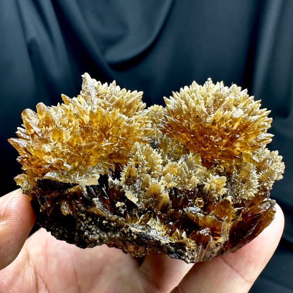 Amber calcite spires with hyalite opal from Guizhou, China, reverse side