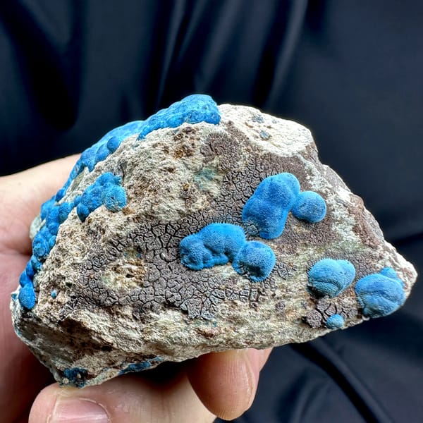 Bright blue chrysocolla balls on grey rock from DR Congo, reverse side