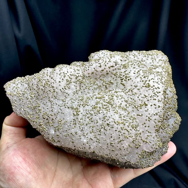 Large lavender-green fluorite floater dusted with pyrite from Jiangxi, China, reverse side