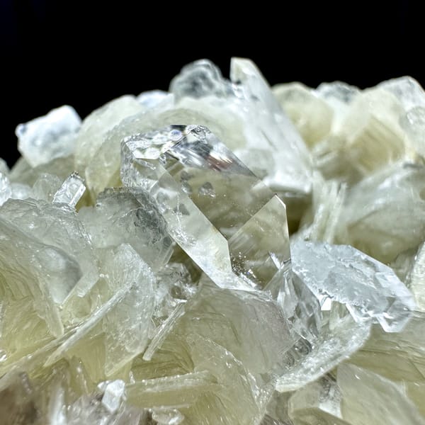 Ultra-clear quartz points among pearly muscovite from Xuebaoding, Sichuan, China, second angle