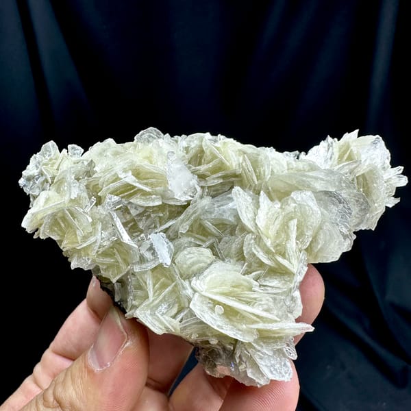 Ultra-clear quartz points among pearly muscovite from Xuebaoding, Sichuan, China, reverse side