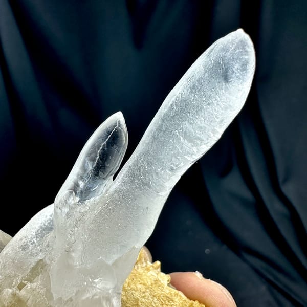 Transparent icicle calcite stalactites on tan base from Yunnan, China, top view
