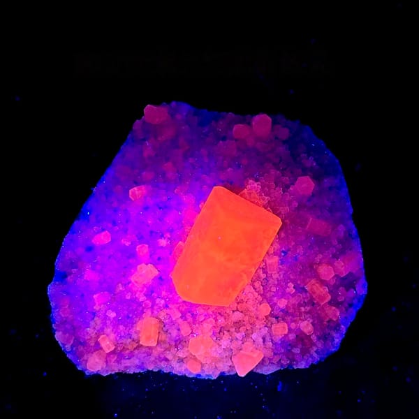 Transparent calcite prism on grey quartz druse from Fujian, China, second angle