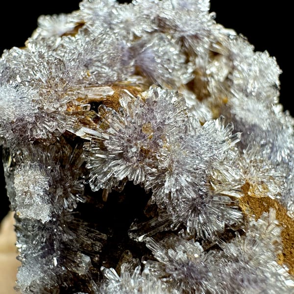 Lavender creedite flowers on ochre matrix from Guizhou, China, reverse side