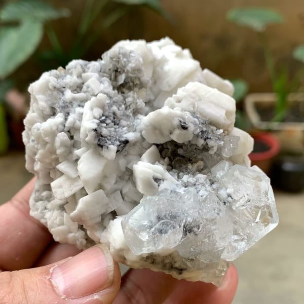 Pale aquamarine crystal on white feldspar with mica from Xuebaoding, Sichuan, China, reverse side