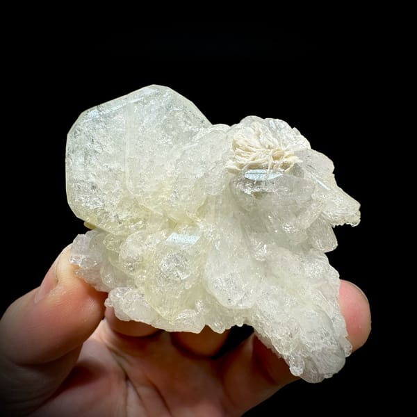 Etched hollowed aquamarine crystal with mica and scheelite from Xuebaoding, Sichuan, China