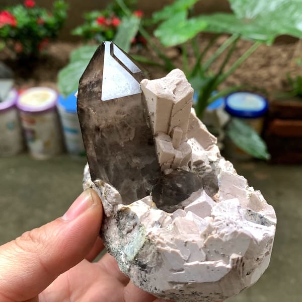 Tall smoky quartz crystal in white feldspar from Fujian, China, reverse side